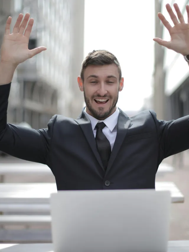 Photo of happy man at this computer