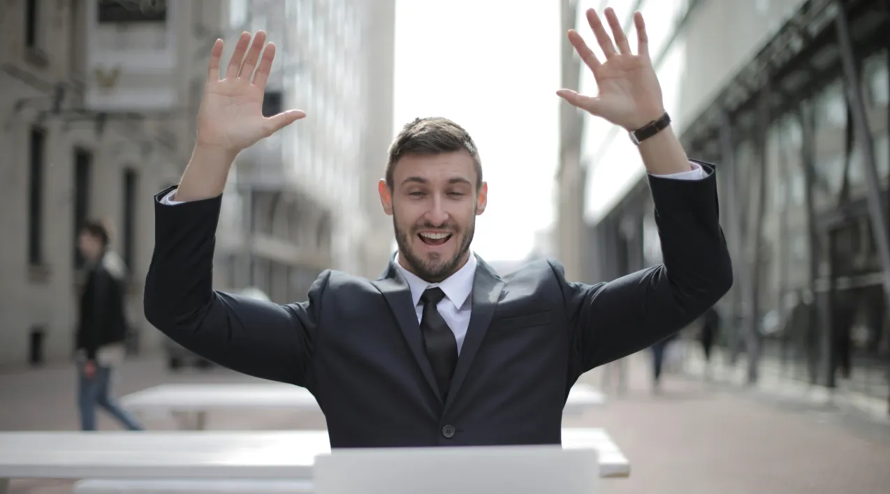 Photo of happy man at this computer